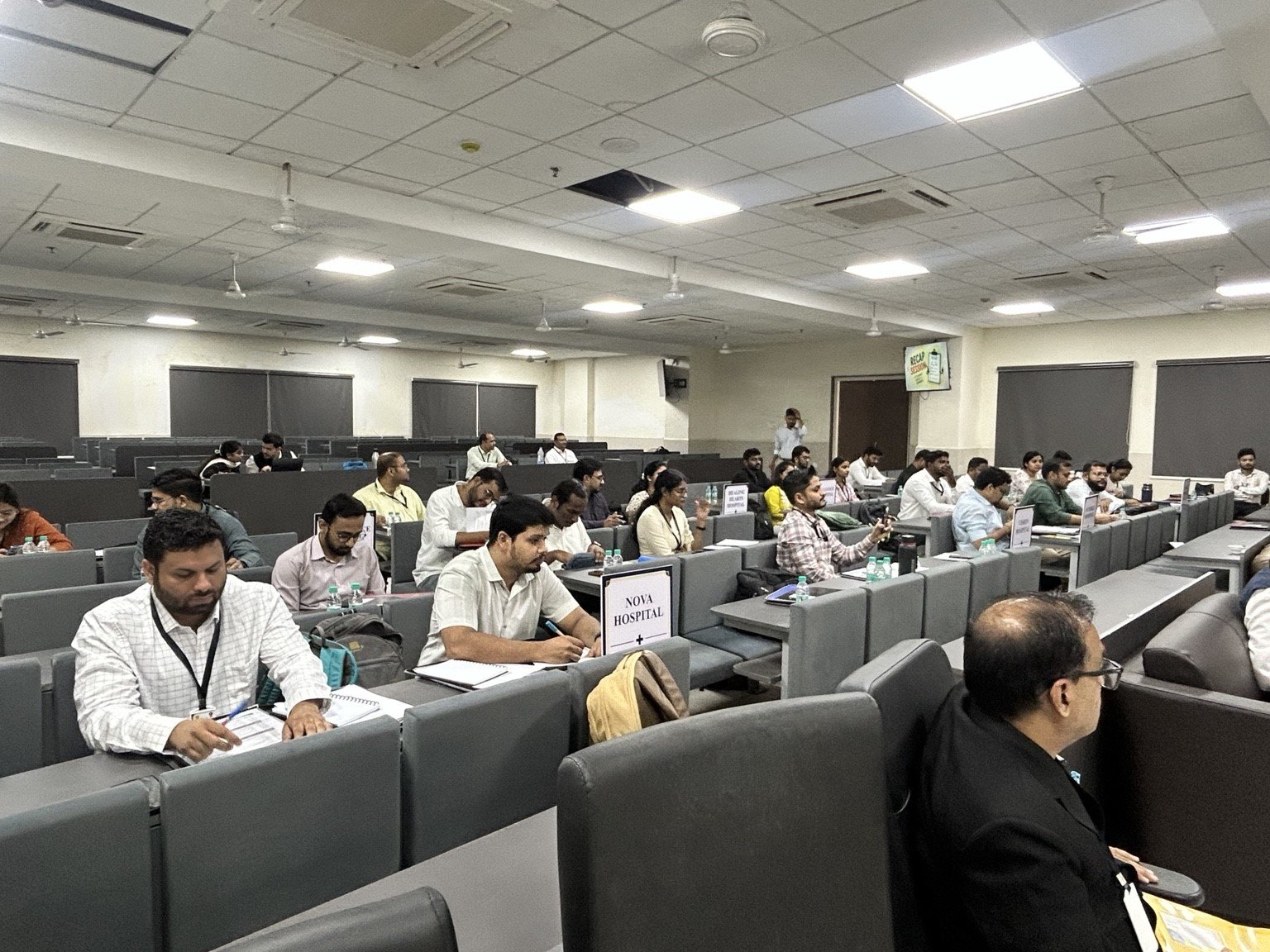 Delegates participating in team-based learning