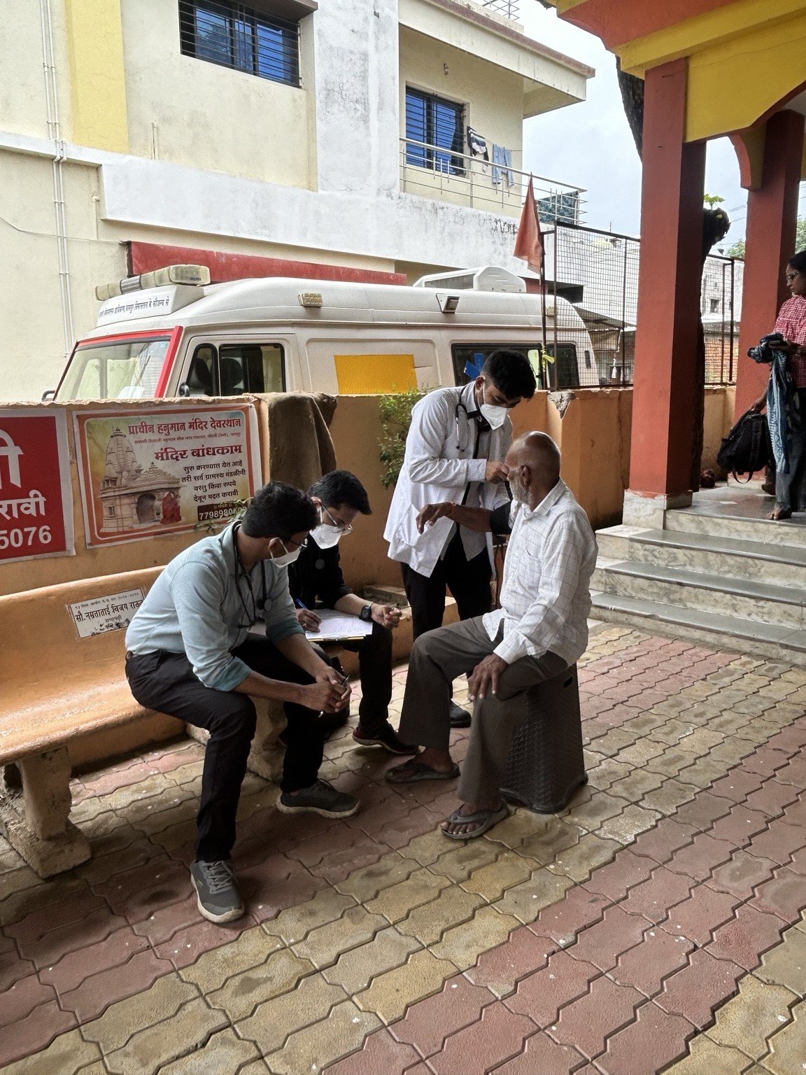 Clinical assessment of an individual during the community health camp