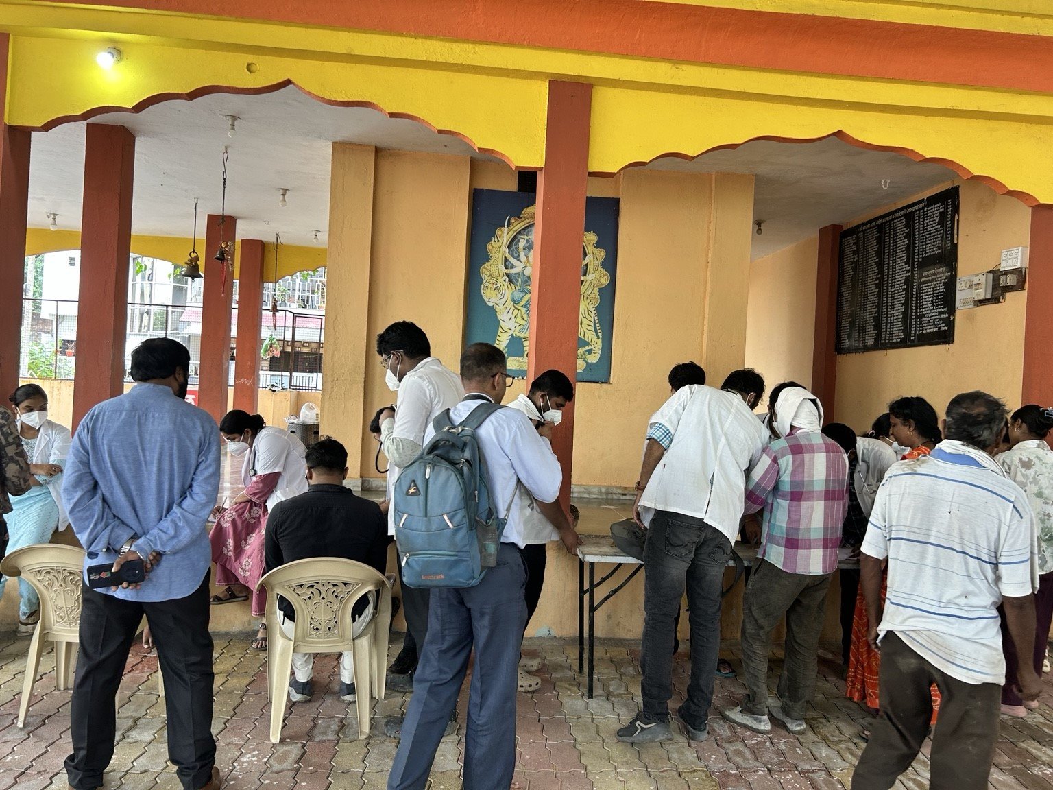 Community members undergoing medical screening and assessment
